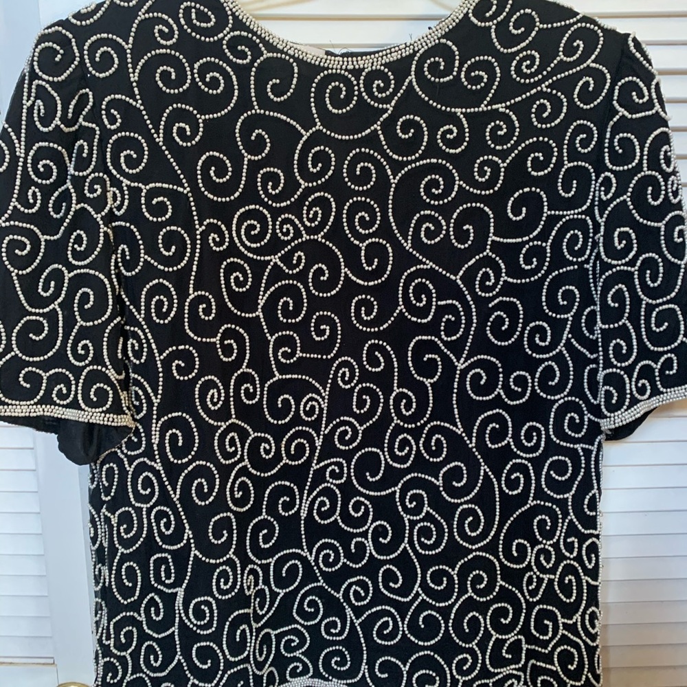 Black blouse with pearl accents and designs